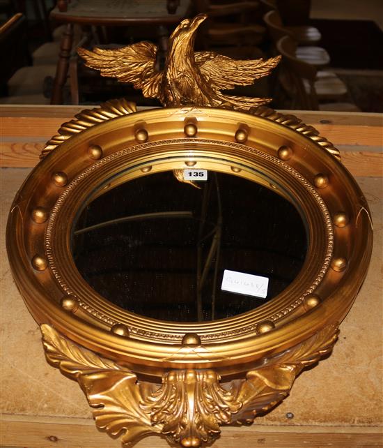 Circular gilt framed mirror